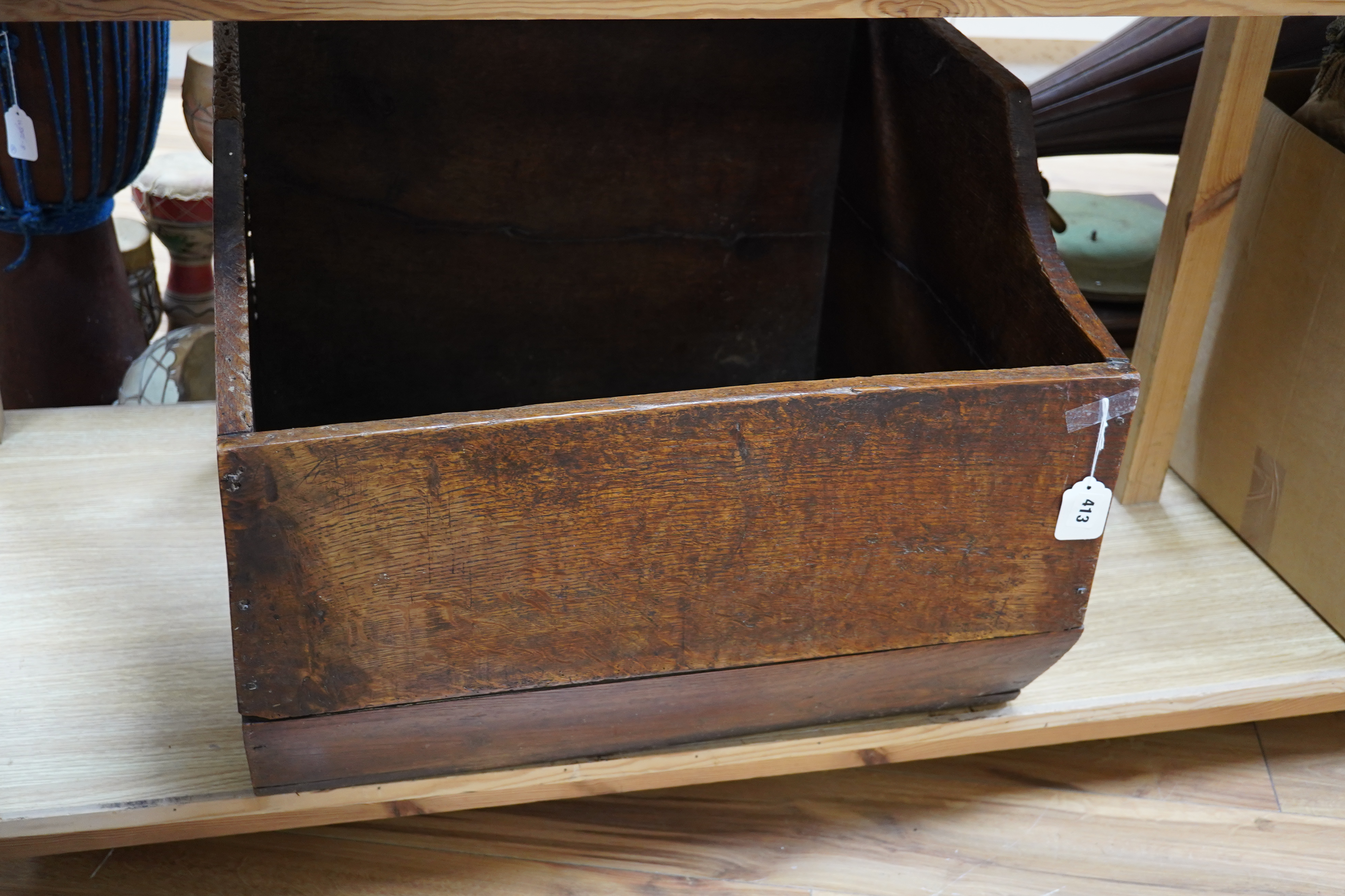 An early 20th century oak dog basket, 65cm wide. Condition - fair